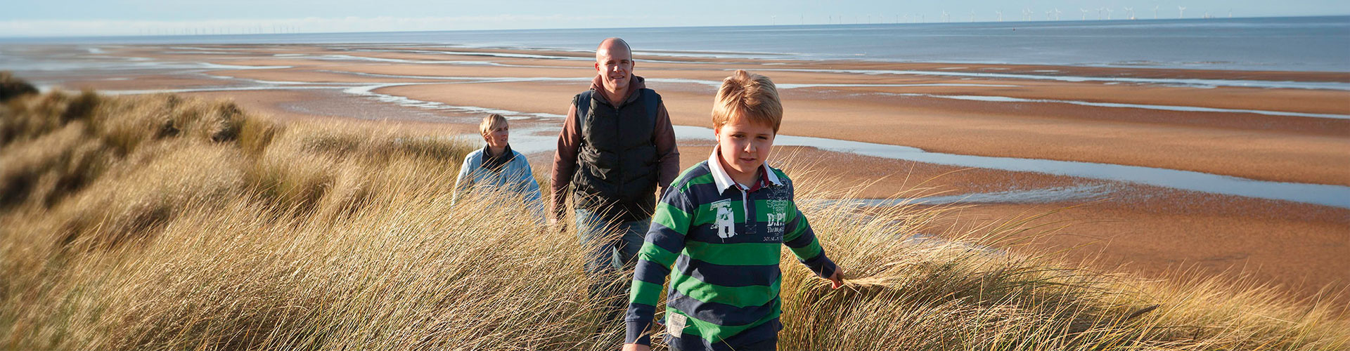 Walkers on Gronant Dunes on the Wales Coast Path