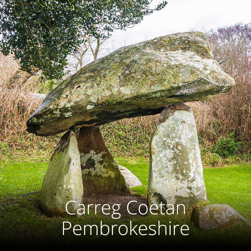 Three massive uprights support the capstone at Carreg Coetan in Pembrokeshire