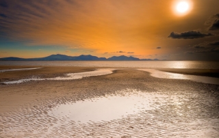 Abermenai beach and strait, Anglesey - with the Snowdonia mountains across the sea