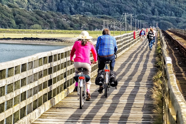 Cycling over Barmouth Bridge on the Wales Coast Path