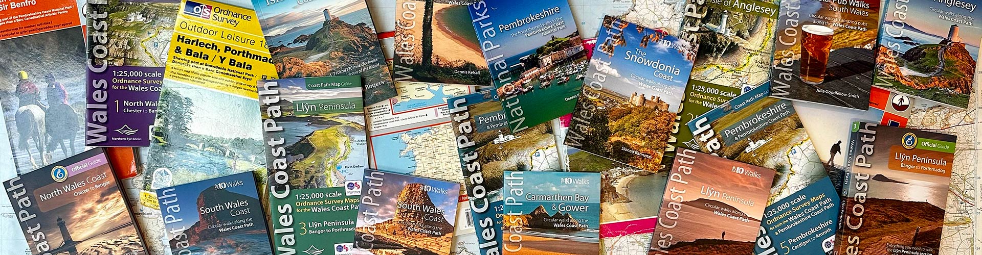 Spread of Wales Coast Path guides and books