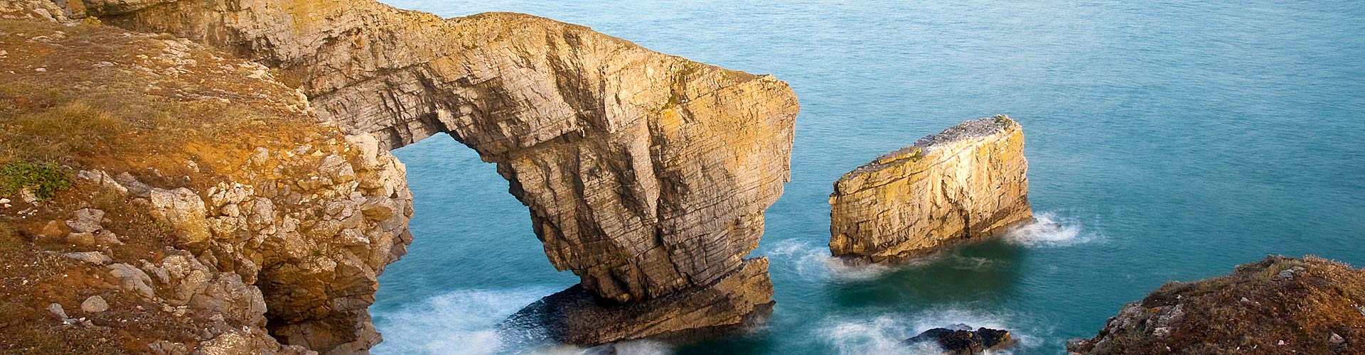 'Green Bridge of Wales' sea arch on the Wales Coast Path